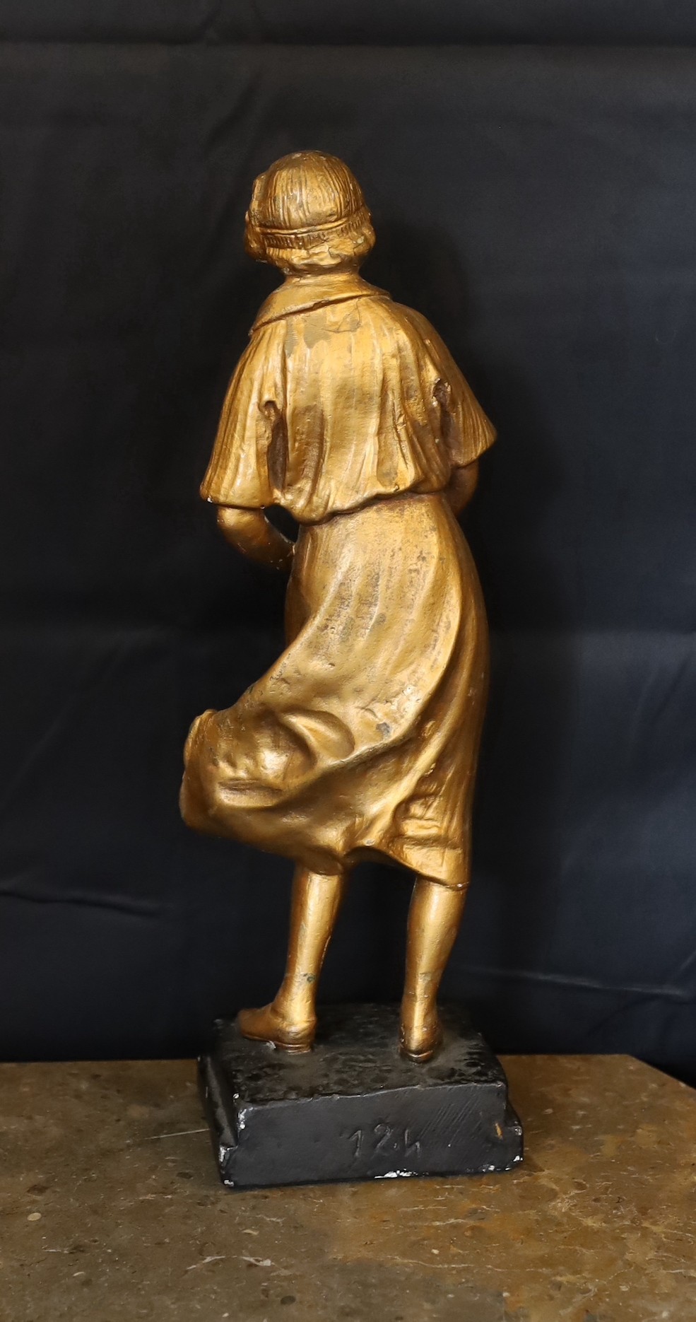 A 1930s French gilt plaster figure of a tennis player ‘Joueuse de Tennis’, height 42cm